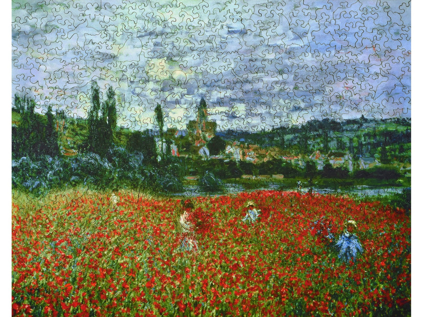 The front of the puzzle, Poppies Near Vetheuil, which shows a field of red poppies in the countryside.