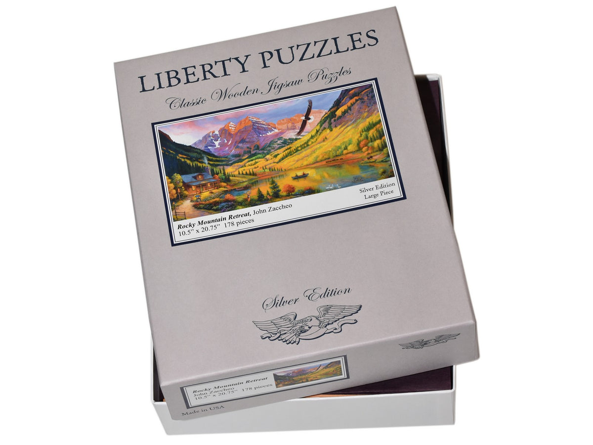 The puzzle Rocky Mountain Retreat with the box that it goes in.