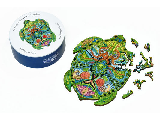 A closeup of the front of the puzzle, Sea Turtle round, partially disassembled, with it's box.