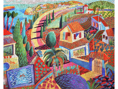 The front of the puzzle, Spanish Coast, depicting a village along the water.