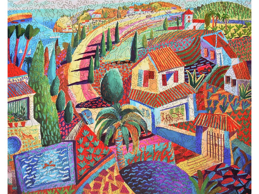 The front of the puzzle, Spanish Coast, depicting a village along the water.
