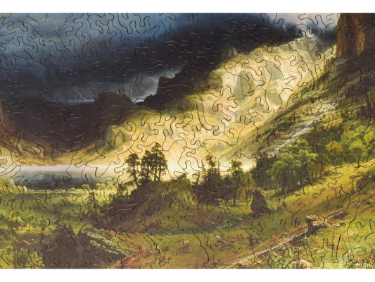 A closeup of the front of the puzzle, Storm in the Rocky Mountains, showing the detail in the pieces.