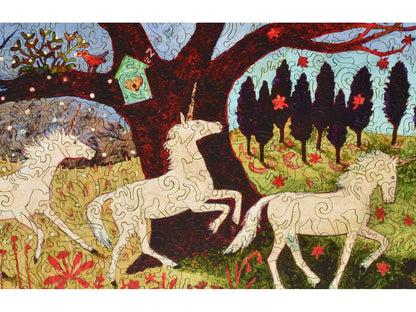 A closeup of the front of the puzzle, Three Unicorns by a Tree, showing the detail in the pieces.