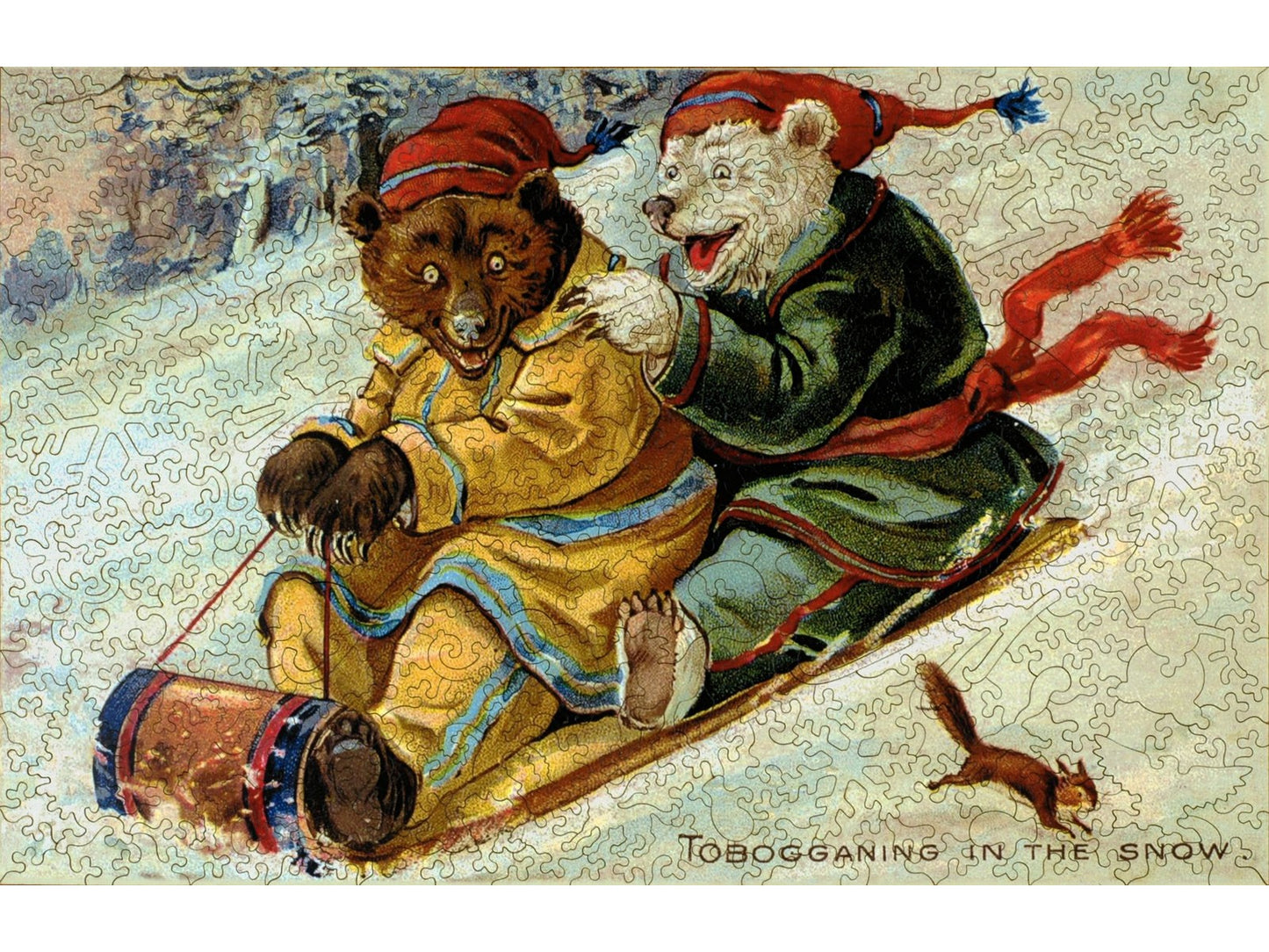 The front of the puzzle, Tobogganing in the Snow, showing two happy bears speeding down a hillside on a sled.