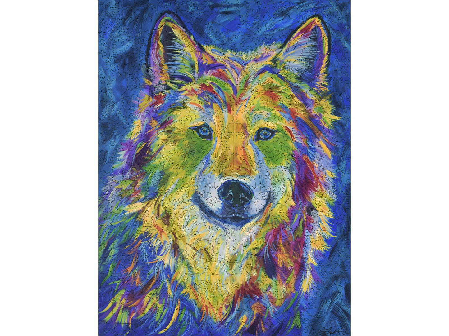The front of the puzzle, Wild in Spirit by Linda Israel, with a colorful wolf.