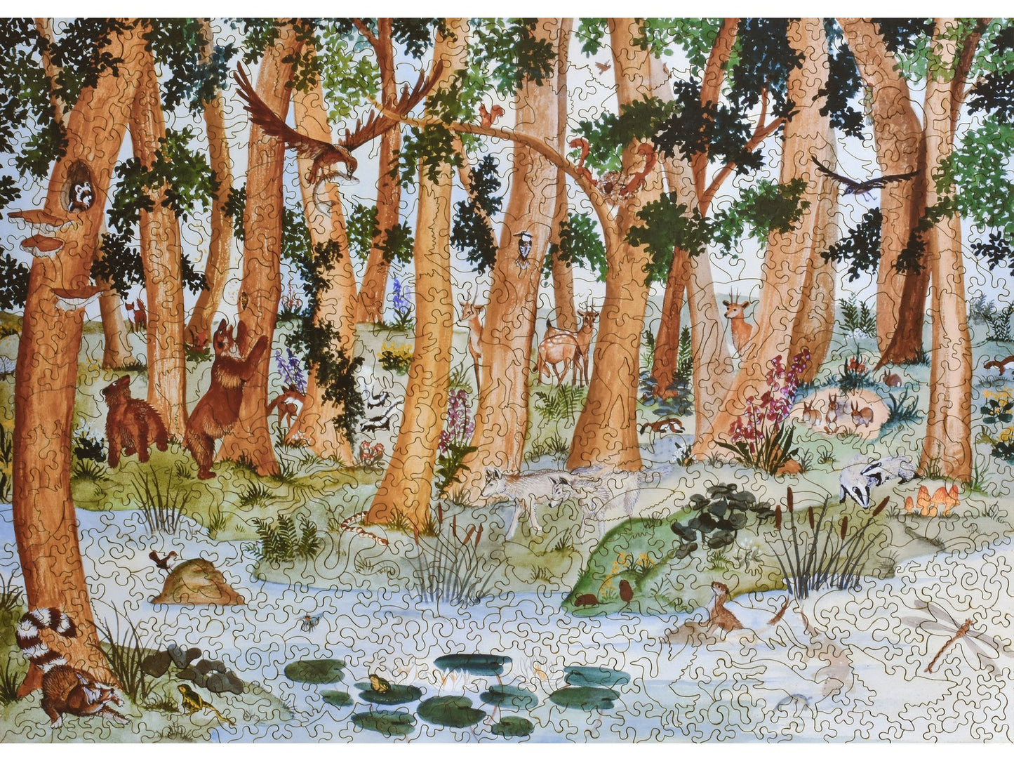 The front of the puzzle, Woodland Scene, with animals in the woods next to a stream.