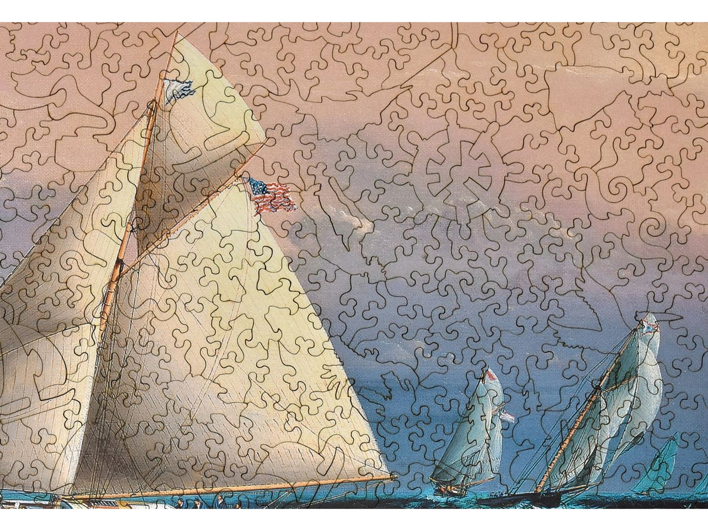 A closeup of the front of the puzzle, Yacht Race Off Boston Light, showing the detail in the pieces.