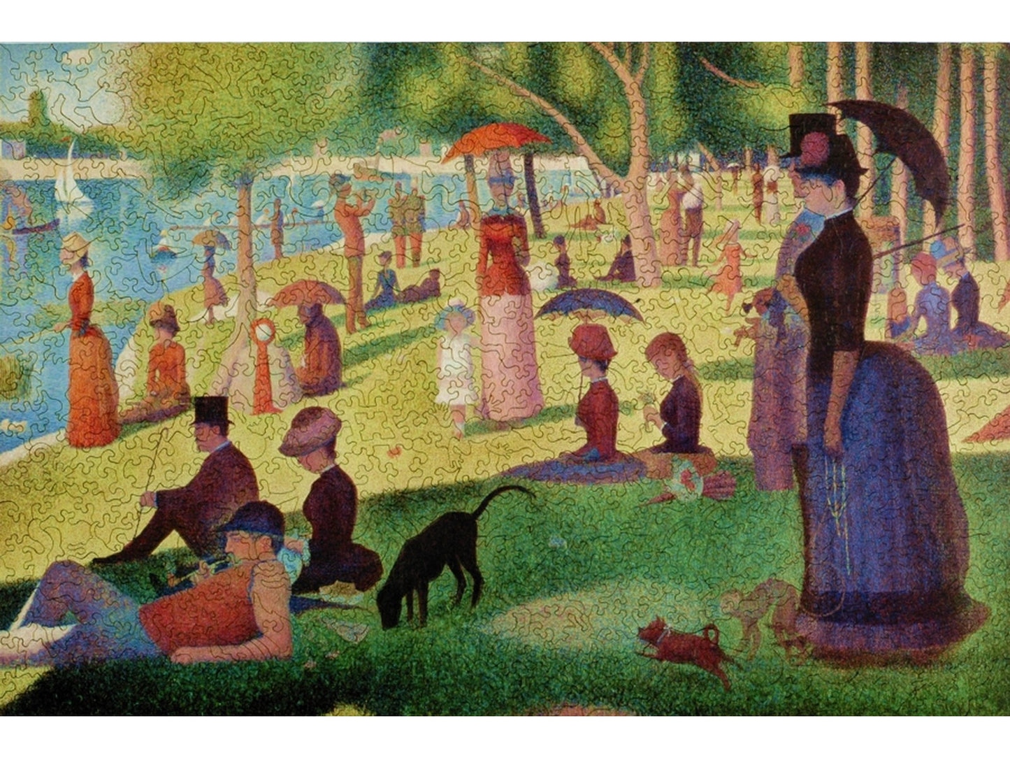 The front of the puzzle, A Sunday on La Grande Jatte, which shows people relaxing in a park on a riverbank.