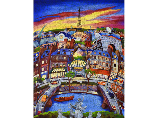 The front of the puzzle, April in Paris, which shows a colorful city scene, at sunset.