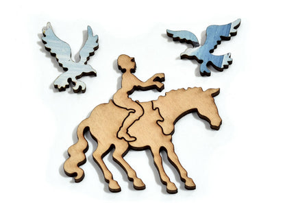 A closeup of pieces in the shape of a person riding a horse and seagulls.