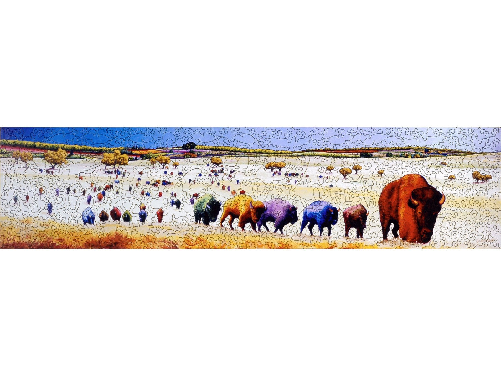 The front of the puzzle, Buffalo Skittles, which shows a prairie landscape scene of a herd of multi-colored bison.