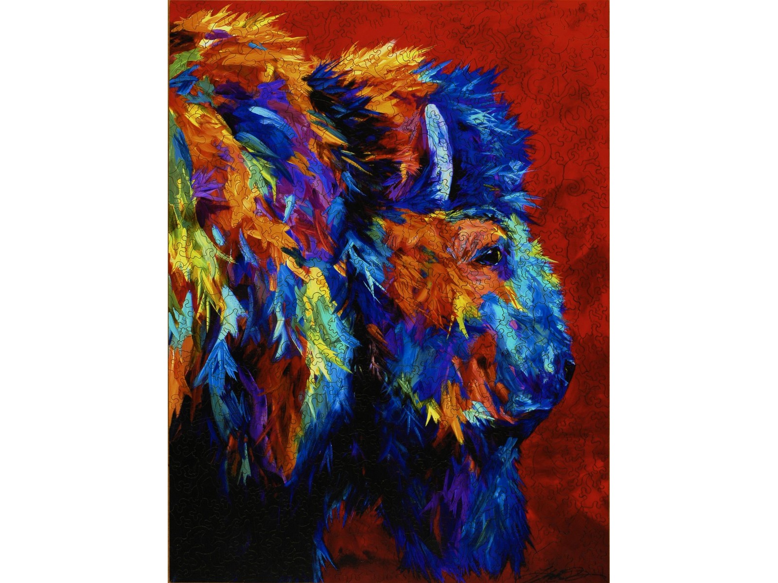 The front of the puzzle, Buffalo Vision, showing a painting of a multi-colored bison. 