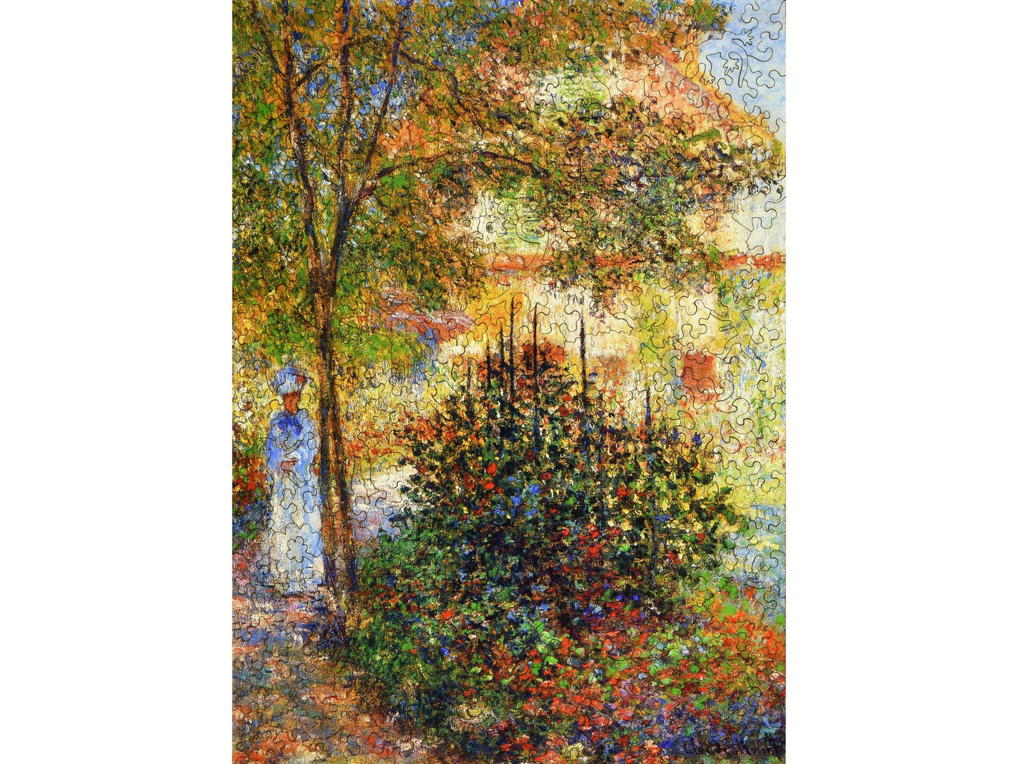 The front of the puzzle, Camille Monet in the Garden, which shows a woman walking in a garden.