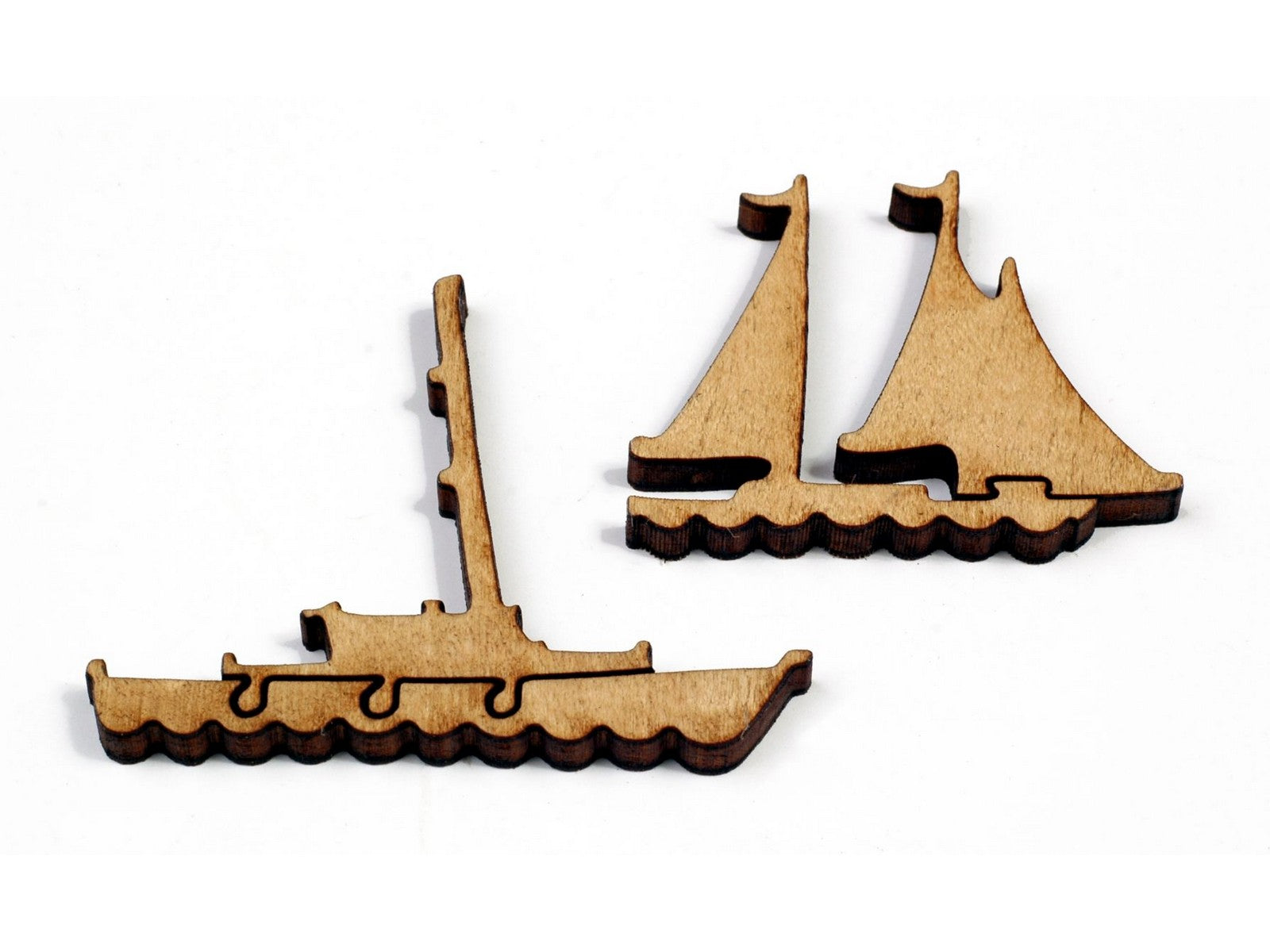 A closeup of some whimsy pieces that can be found in the puzzle, A Map of Interesting Cape Cod, picturing two sailboats.