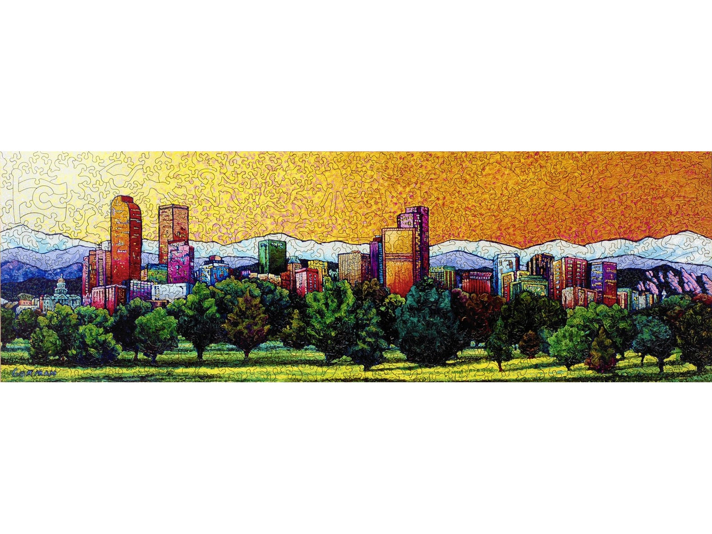 The front of the puzzle, Denver Cityscape, which shows a city skyline with mountains behind it.