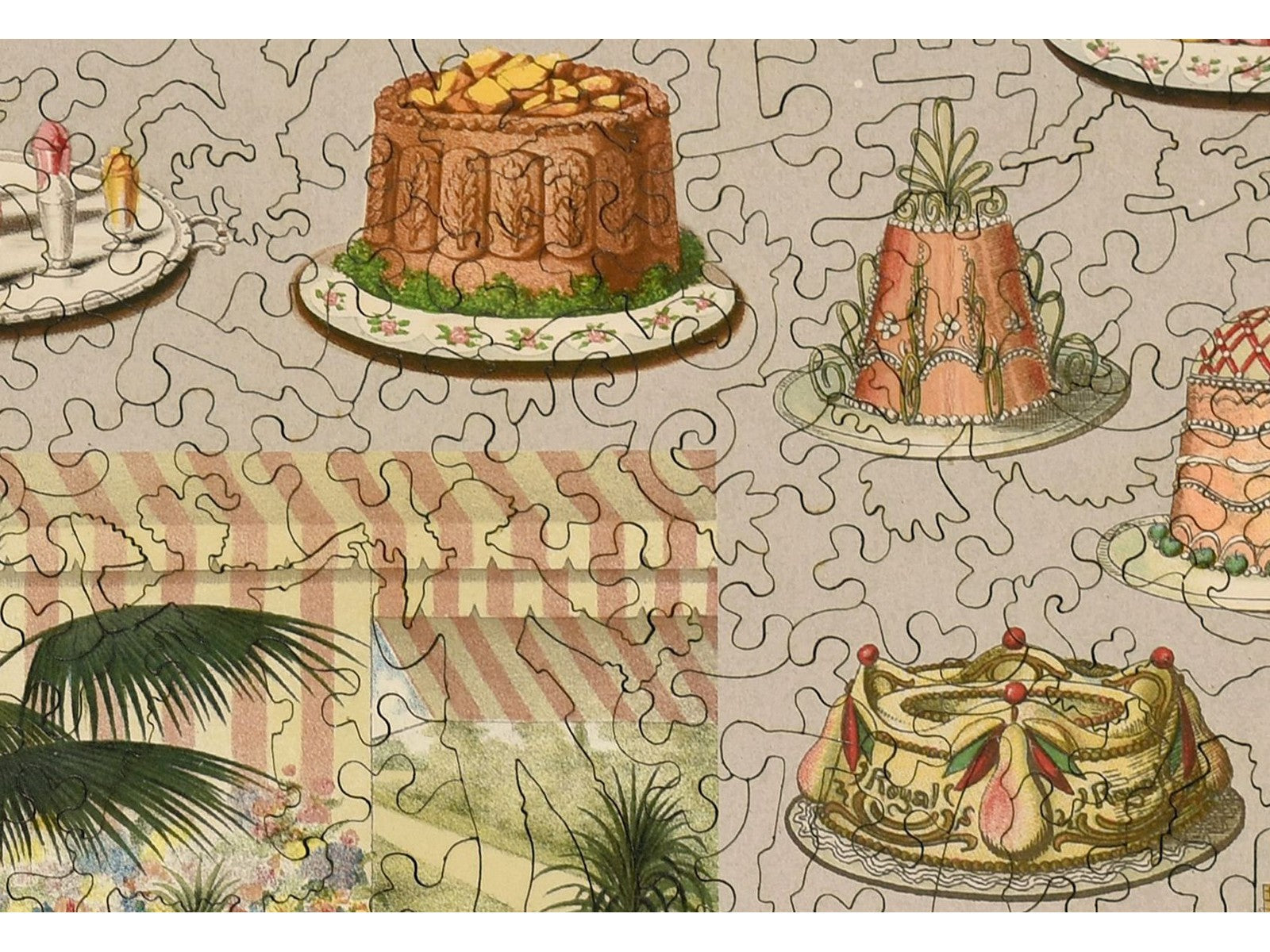 A closeup of the front of the puzzle, Fancy Cakes, showing the detail in the pieces.