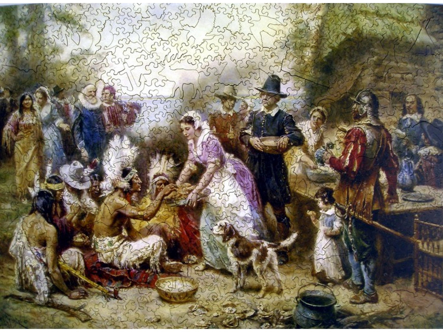 The front of the puzzle, The First Thanksgiving, 1621, which shows a group of people having a feast.
