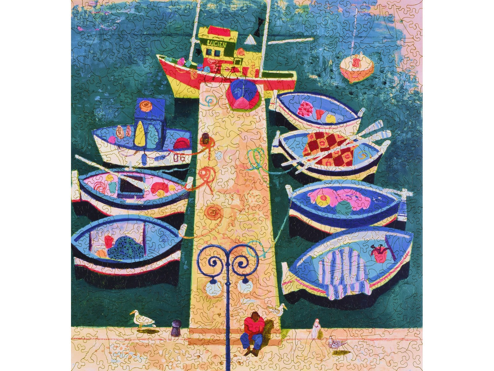 The front of the puzzle, Fisherman's Jetty, Antibes, which shows  fishing boats tied up to a pier.