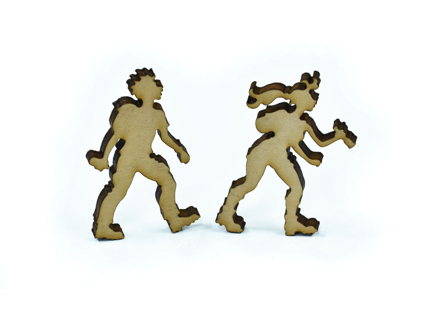A closeup of pieces in the shape of two hikers.