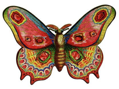 The front of the puzzle, Flutter By, showing a brightly colored moth, with an irregular border.