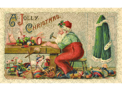The front of the puzzle, Working Late, which shows santa claus at a workbench making toys.