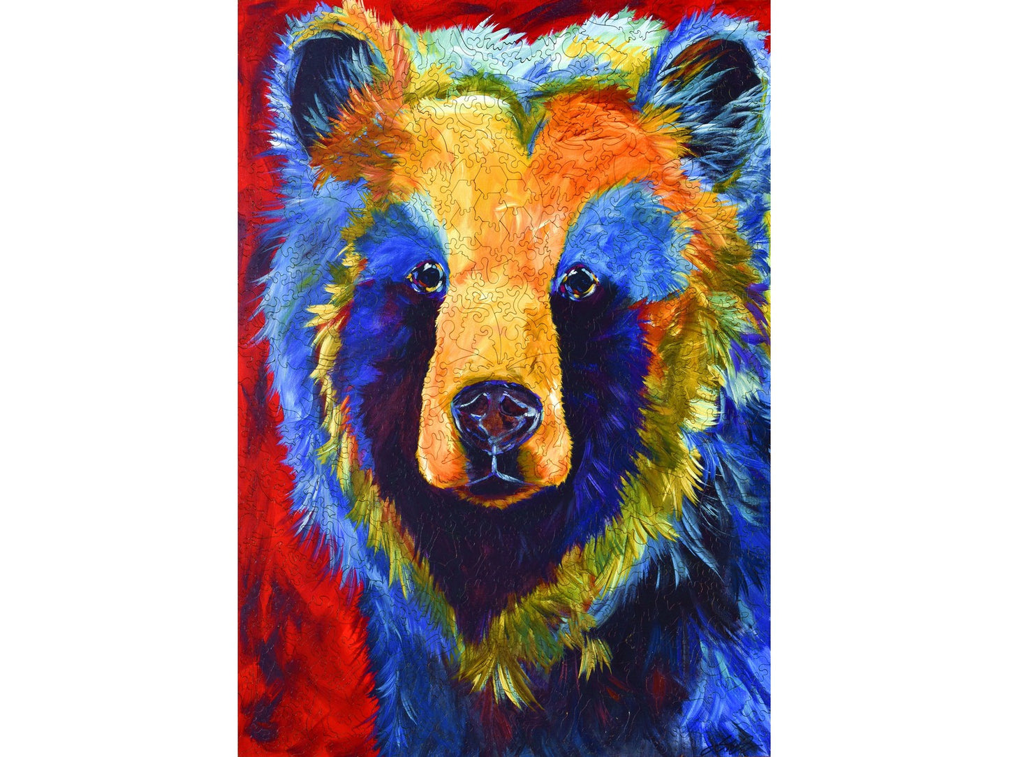 The front of the puzzle, The Heart of a Bear, which shows a brightly colored portrait of a bear.