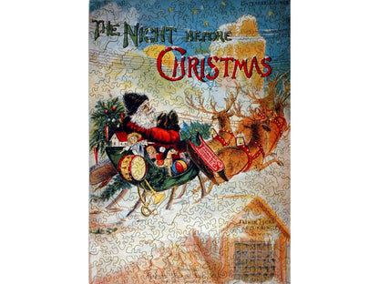 The front of the puzzle, Kris Kringle Series, which shows Santa Claus in his sleigh on a rooftop.