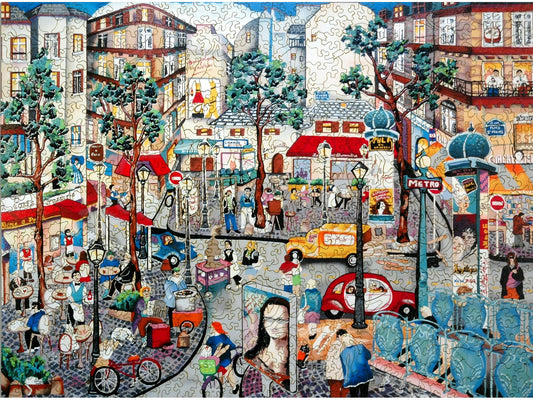 The front of the puzzle, Left Bank Afternoon, which shows a busy city scene in Paris.