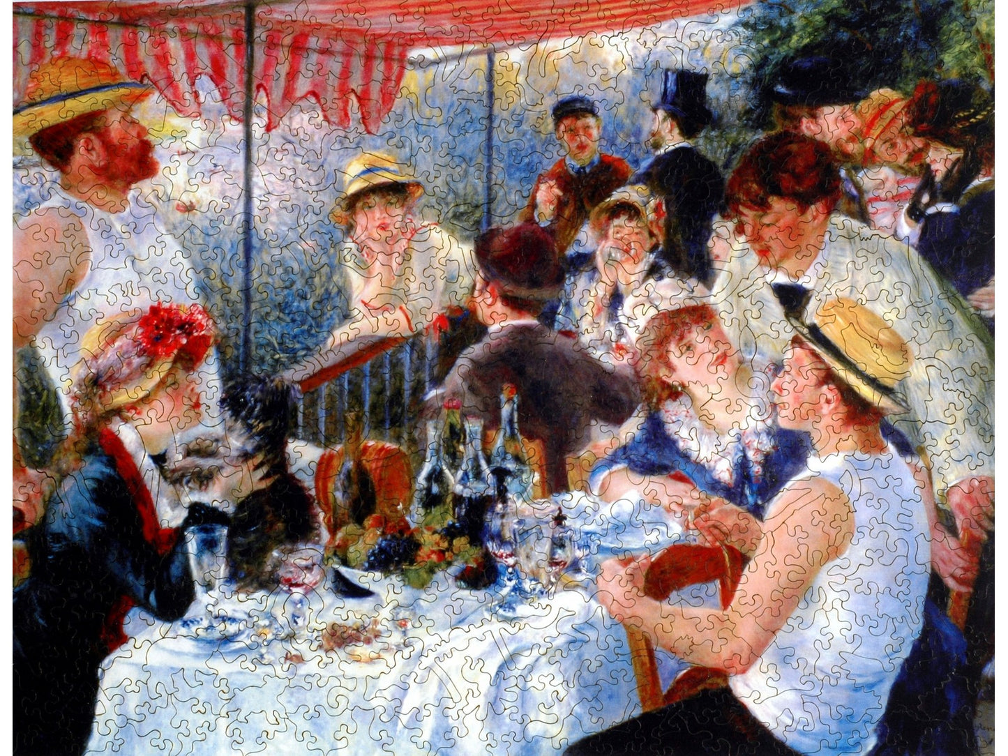 The front of the puzzle, Luncheon of the Boating Party, which shows a group of people around a table in a cafe.