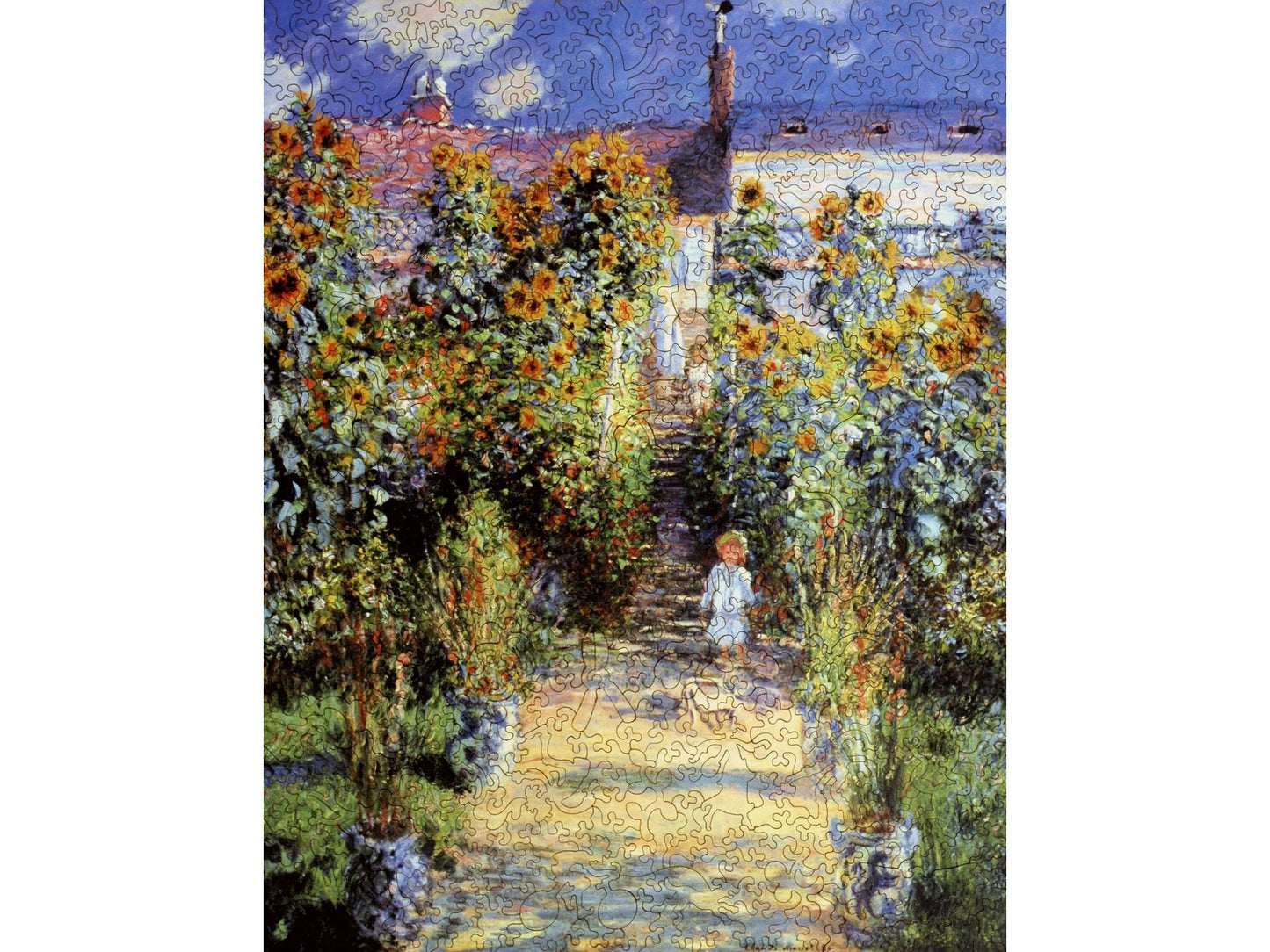 The front of the puzzle, The Artist's Garden at Vetheuil, which shows a child on a garden path.