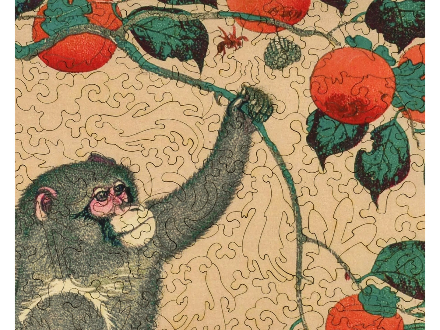 A closeup of the front of the puzzle, Monkey in Persimmon Tree, showing the detail in the pieces.