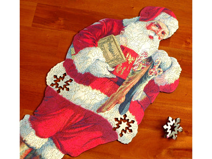 A closeup of the front of the puzzle, Morse's Santa Claus, with a few pieces pulled out.