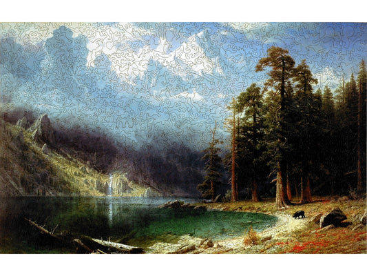 The front of the puzzle, Mt. Corcoran, which shows a mountain landscape scene of a lake with a waterfall and snow covered peaks behind it.