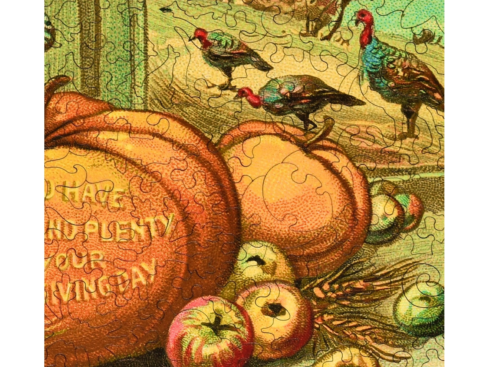 A closeup of the front of the puzzle, Peace and Plenty Thanksgiving, showing the detail in the pieces.