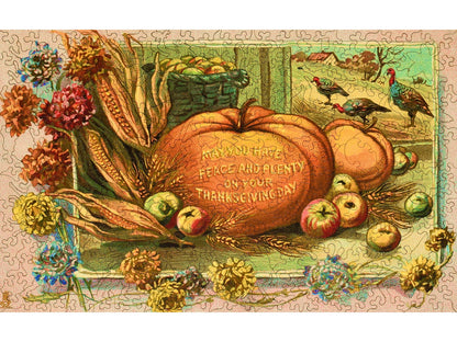 The front of the puzzle, Peace and Plenty Thanksgiving, which shows a fall harvest on a farm.