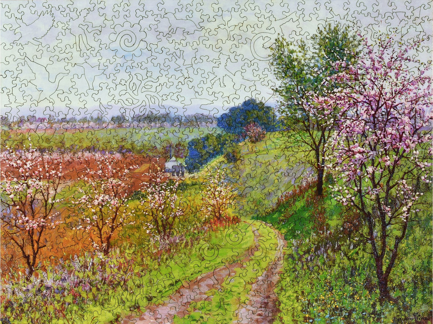 The front of the puzzle, Road with Blossoming Trees, which shows a road in the country during the spring.