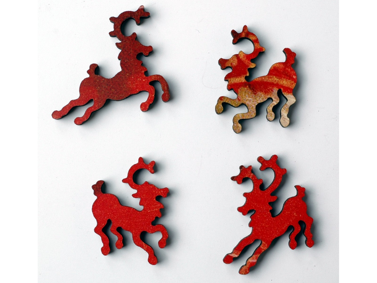 A closeup of pieces in the shape of reindeer.