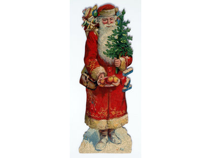 The front of the puzzle, Saint Nicholas, which shows Santa Claus smiling and holding a plate of treats and a small Christmas tree.