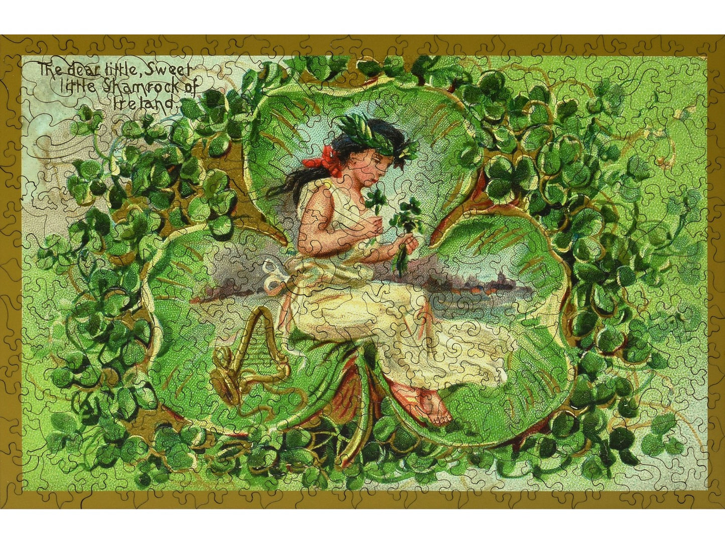 The front of the puzzle, Shamrock of Ireland, which shows a girl holding some shamrocks, surrounded by a decorative shamrock border.
