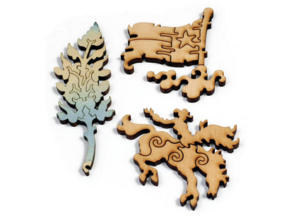 A closeup of some whimsy pieces that can be found in the puzzle, Texas Map, the pieces are shaped like a tree, a flag, and a man riding a horse.