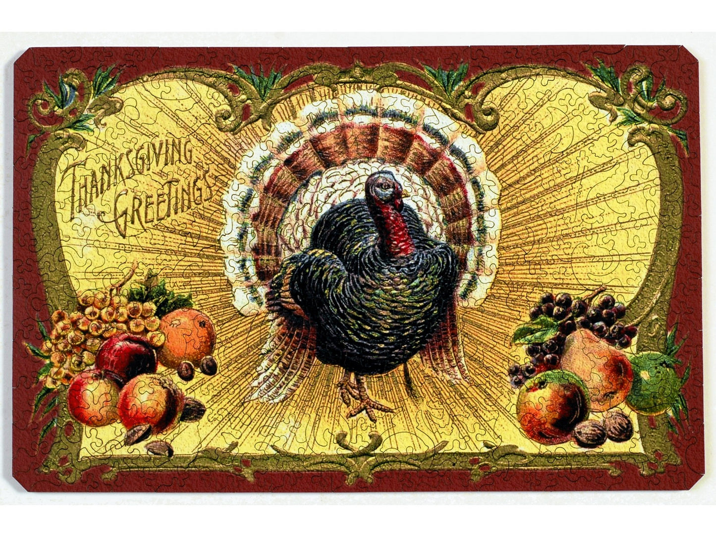 The front of the puzzle, Thanksgiving Postcard, which shows a turkey surrounded by fruit and a decorative border.