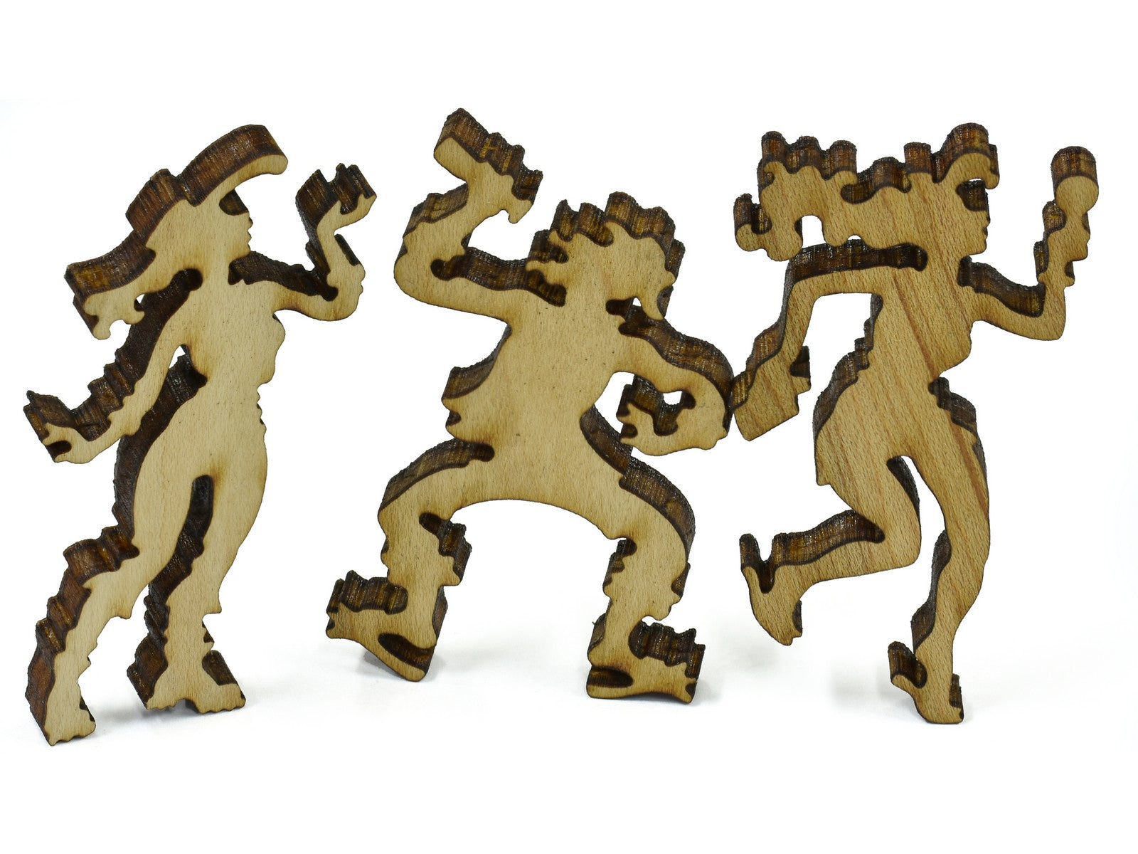 A closeup of pieces in the shape of three people dancing.