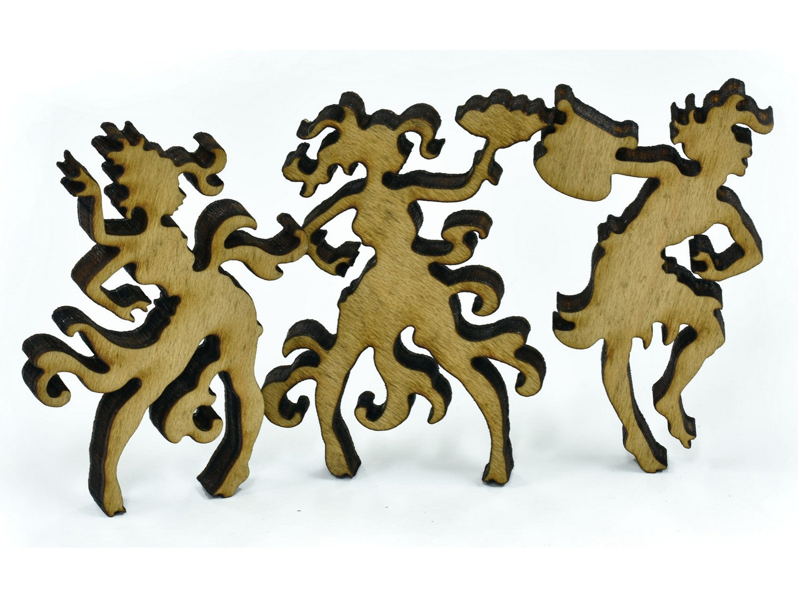 A closeup of pieces shaped like three dancers.