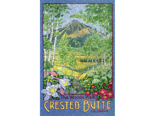 The front of the puzzle, The Woods Walk, Crested Butte, Colorado, which shows a landscape scene with aspen trees and flowers in the foreground, with a meadow and a mountain in the background.