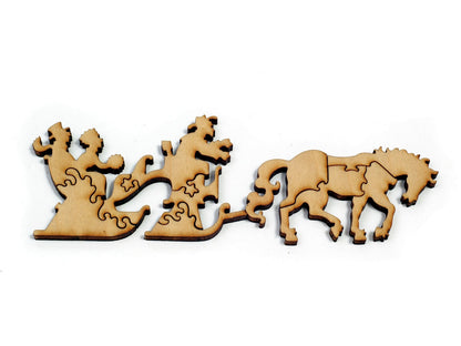 A closeup of pieces in the shape of horse drawn sleigh.