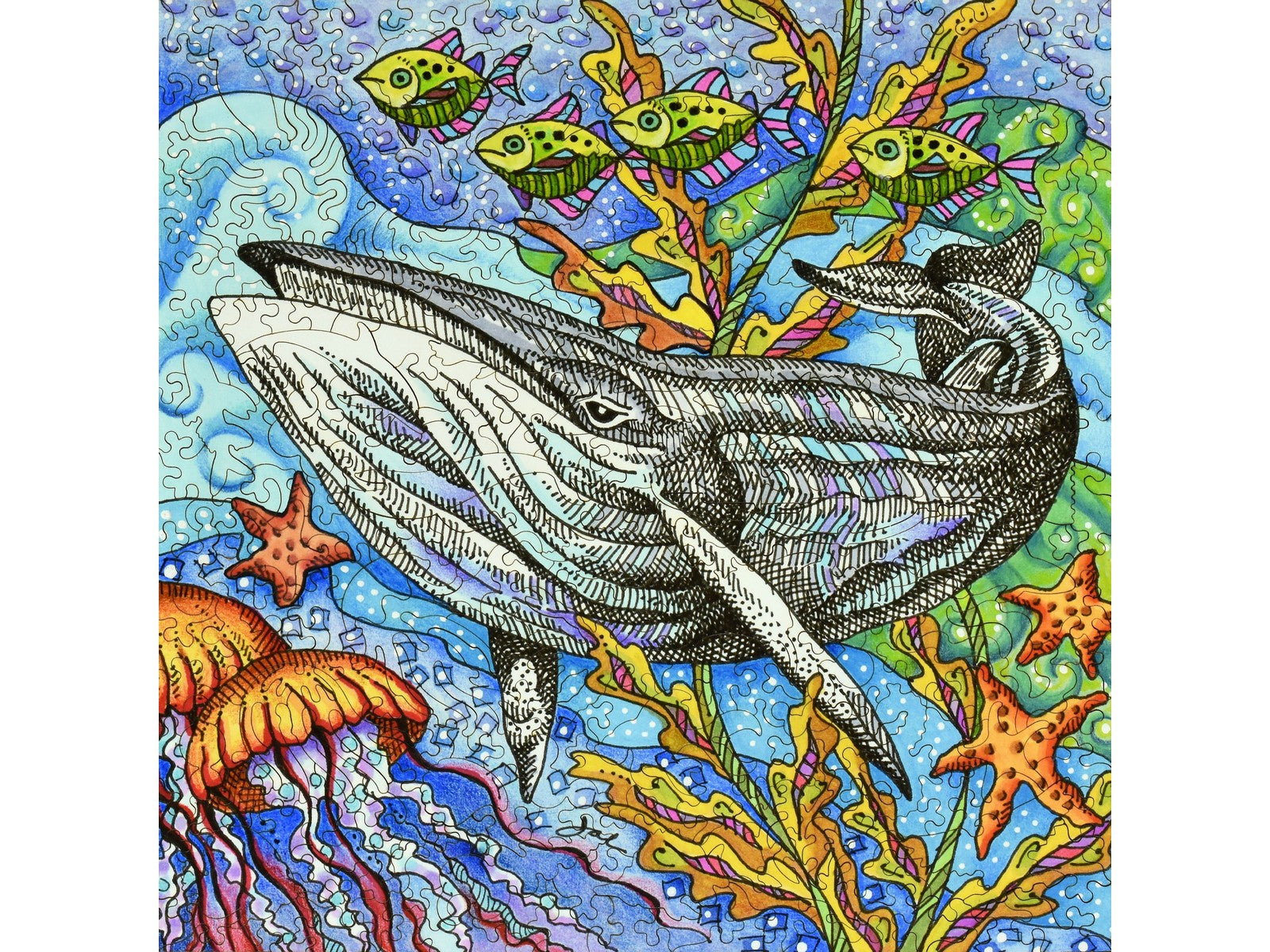 The front of the puzzle, Under the Sea, showing a humpback whale and fish underwater.