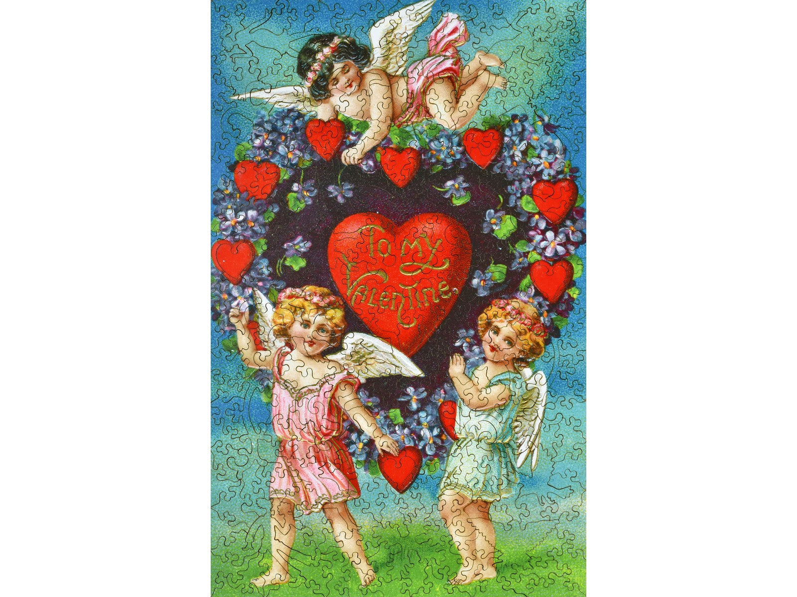 The front of the puzzle, Valentine with Cherubs, which shows three cherubs surrounding a heart and flowers.