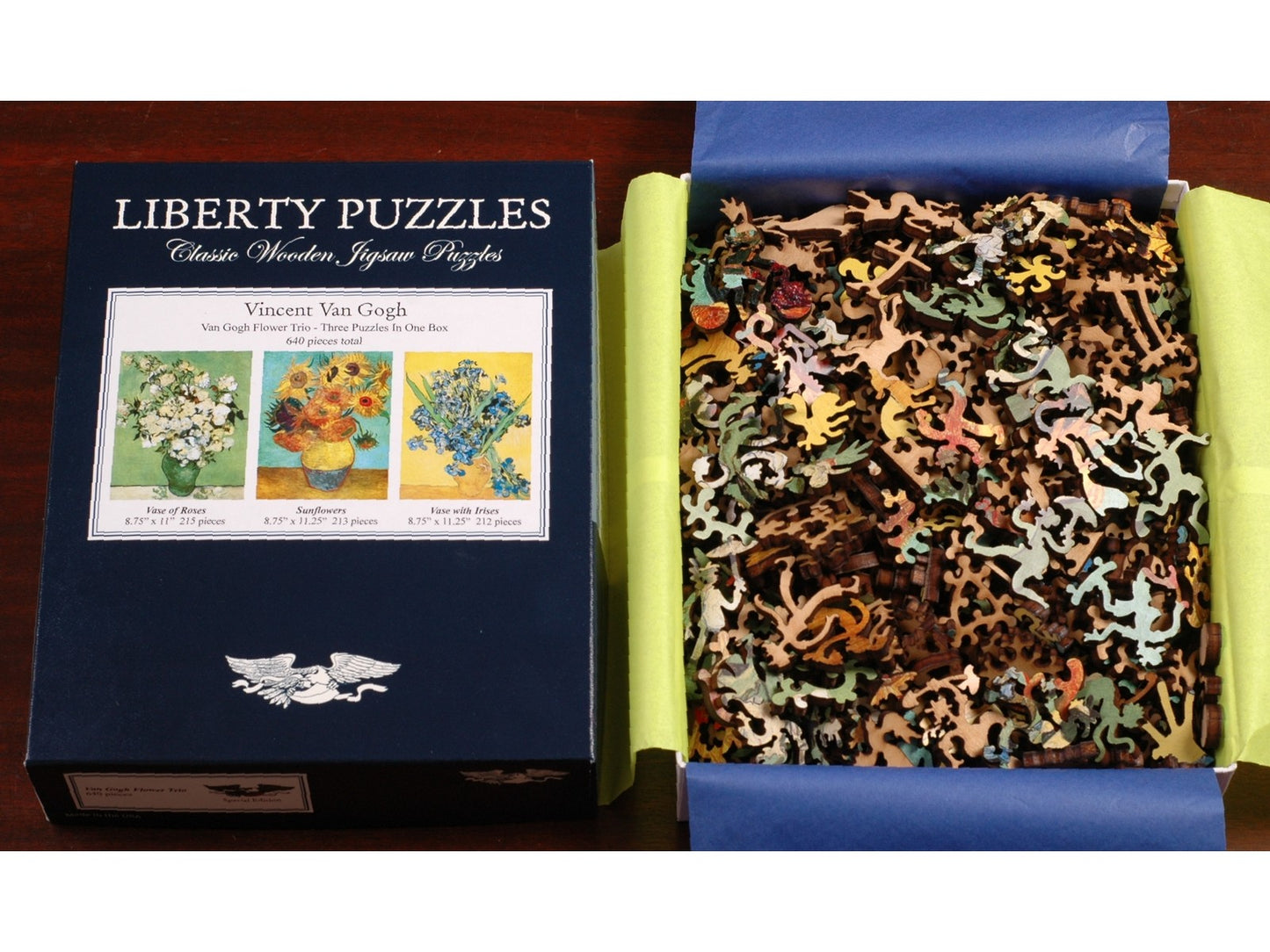 A picture of the puzzle, Van Gogh Flower Trio, taken apart and with its box lid.
