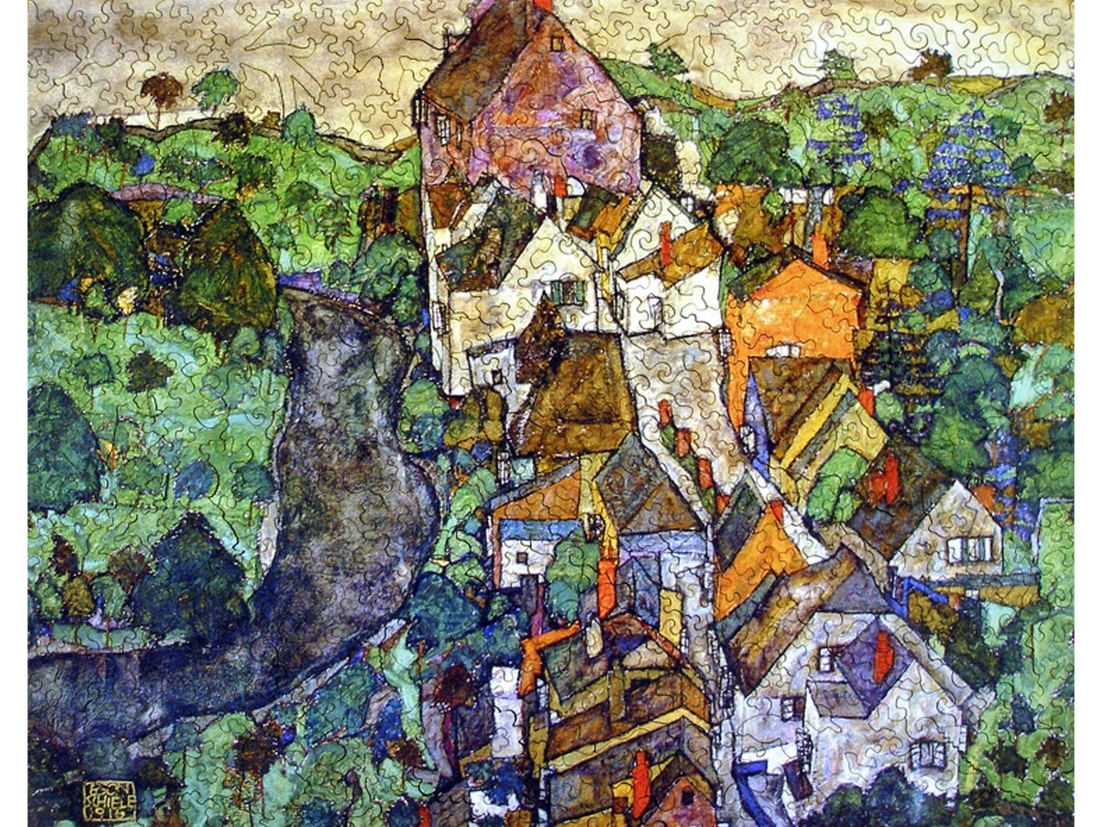 The front of the puzzle, View of Krumau, which shows a small village in the countryside.