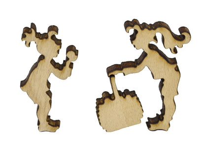 A closeup of pieces in the shape of two girls playing.